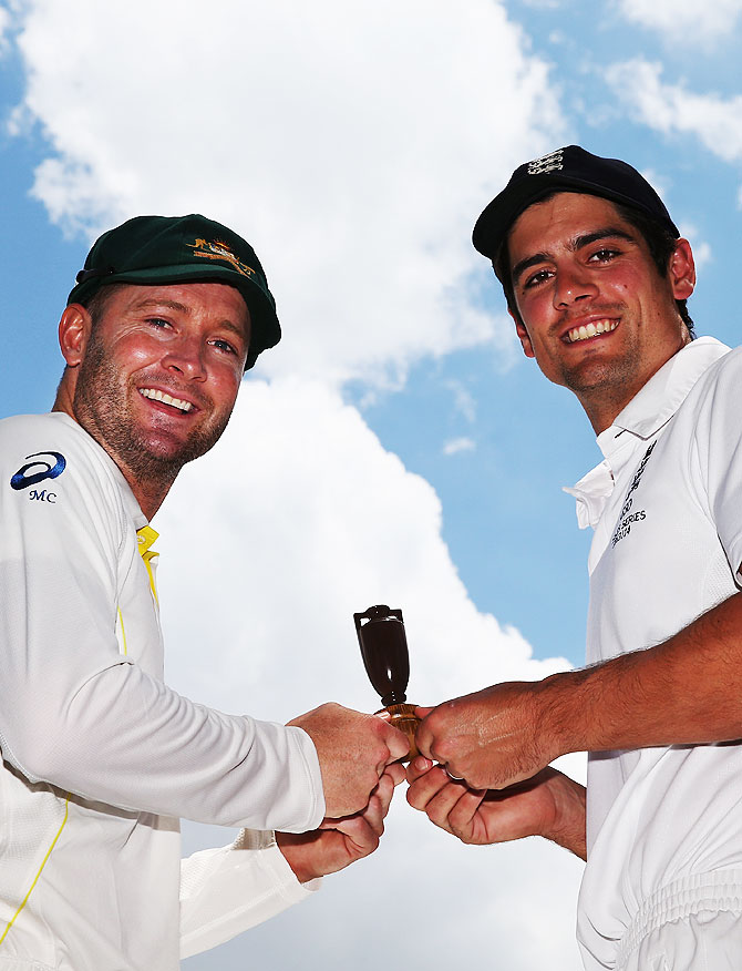 Australia captain Michael Clarke and England captain Alastair Cook hold a replica urn during an Ashes captain's photocall at The Gabba in Brisbane on Wednesday