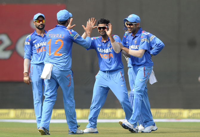 Suresh Raina of India celebrates the wicket of Marlon Samuels of West Indies 