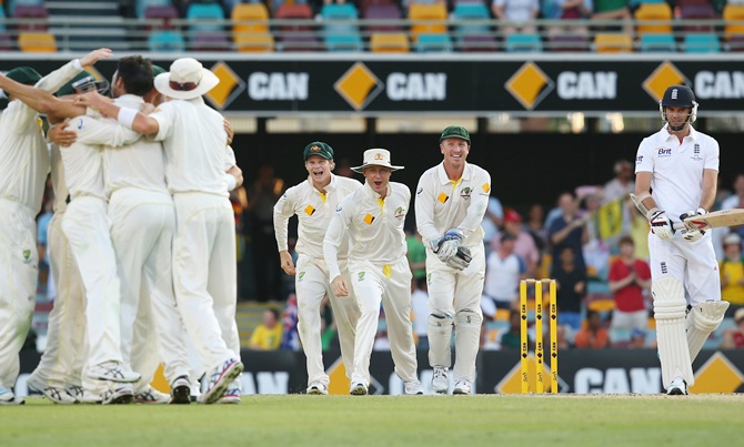 Steve Smith, Michael Clarke and Brad Haddin of Australia celebrate victory after Mitchell   Johnson of Australia took the wicket of James Anderson