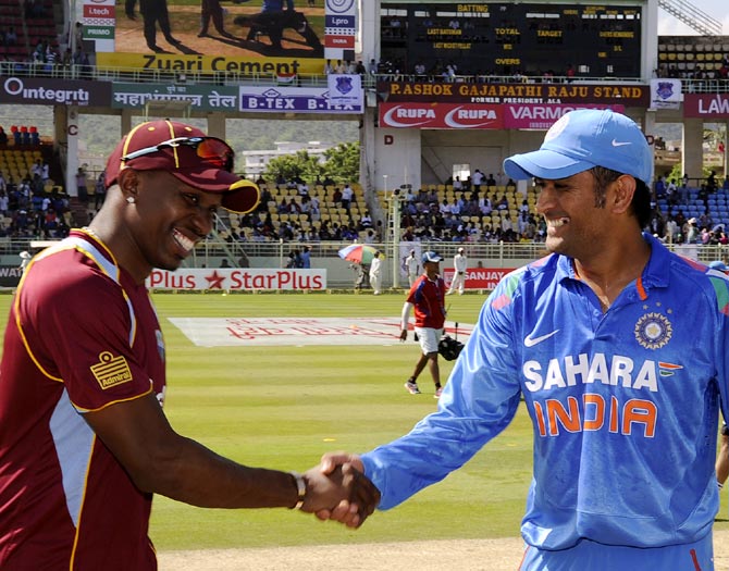 West Indies captain Dwayne Bravo (left) with India's captain Mahendra Singh Dhoni