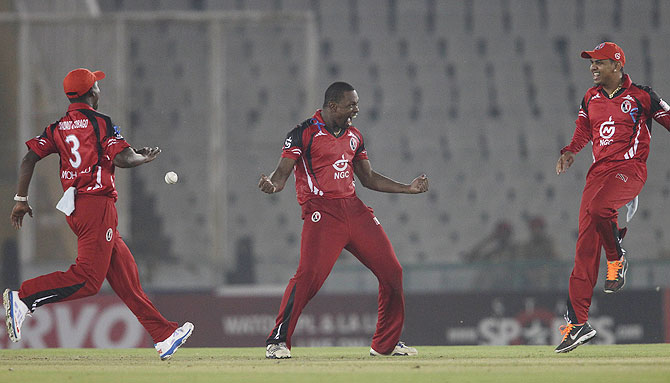 Navin Stewart of Trinidad&Tobago celebrates a wicket 