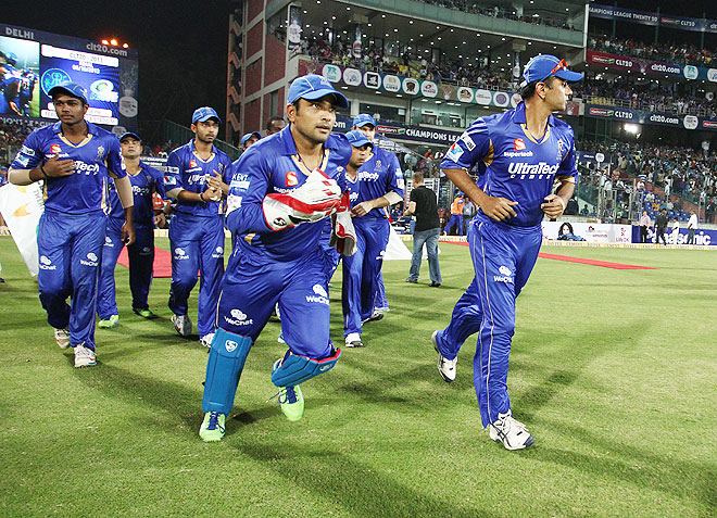 Rajasthan Royals captain Rahul Dravid leads his players out for the last time during the final of the Champions League T20 against Mumbai Indians on Sunday