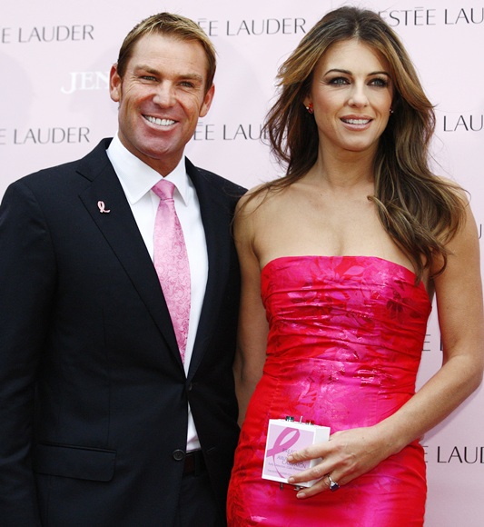 Shane Warne stands next to his fiance actress and model Liz Hurley