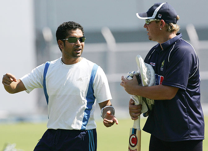 Sachin Tendulkar speaks with Shane Warne during training at the Brabourne stadium in Mumbai in 2004