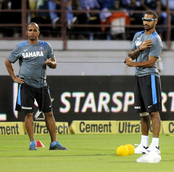 Shikhar Dhawan (right) with trainer Sudarshan VP