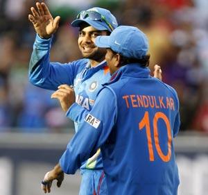 Virat Kohli (left) with Sachin Tendulkar