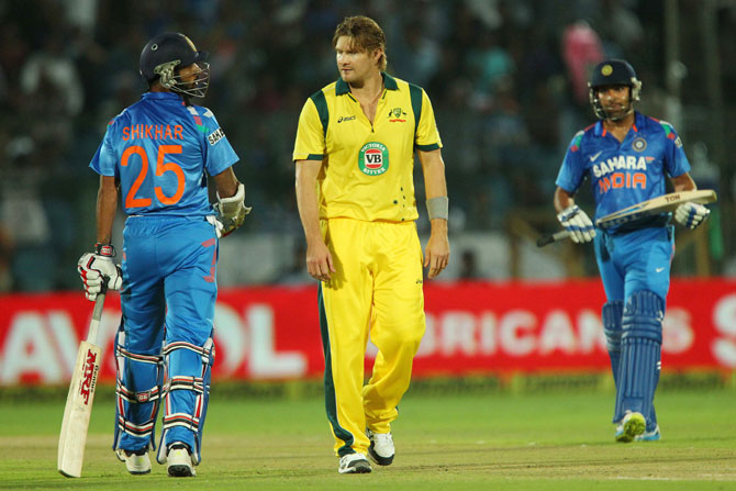 Shane Watson of Australia has something to say to Shikhar Dhawan of India after being hit for four