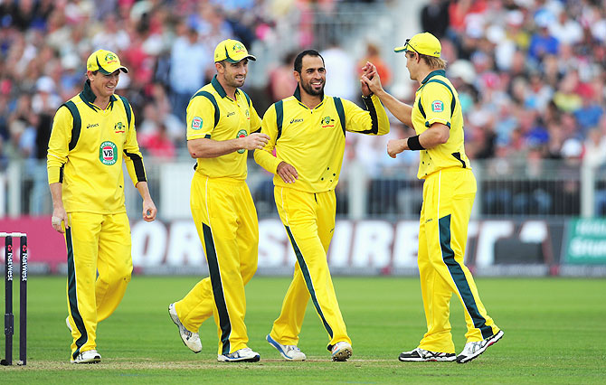Australia bowler Fawad Ahmed (2nd from right) celebrates with teammates after picking a wicket