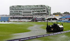 Puddles form on the outfield as rain delays the start of play at Headingley Carnegie Stadium on in Leeds, England, on Friday