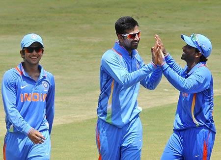 Ashok Menaria (centre) celebrates with team mates