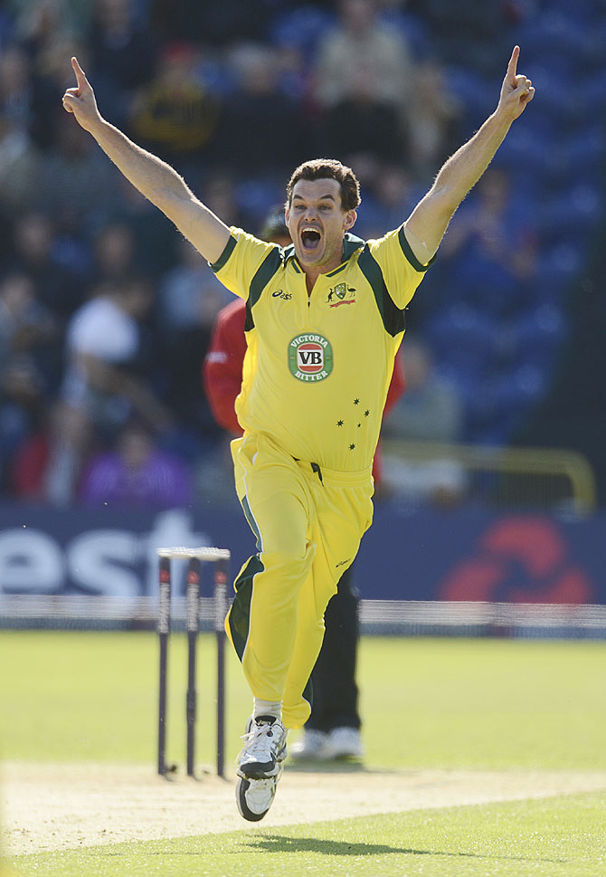 Australia's Clint McKay celebrates after achieving a hat-trick on Saturday