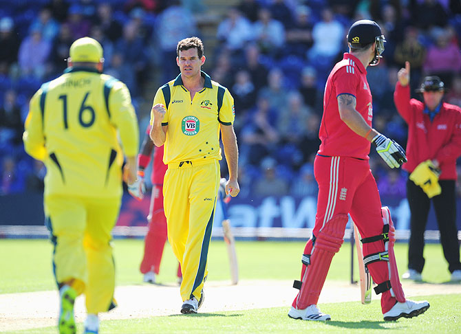 Australia bowler Clint Mckay (centre) celebrates after taking the first wicket of his hat trick by dismissing England batsman Kevin Pietersen on Saturday