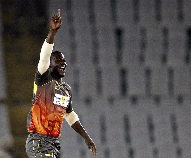 Darren Sammy celebrates after picking up the wicket of Shehan Jayasuriya