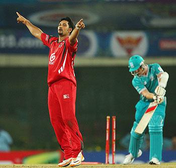 Ravindarnath Rampaul of Trinidad & Tobago celebrates the wicket of Alister McDermott of Brisbane Heat on Sunday