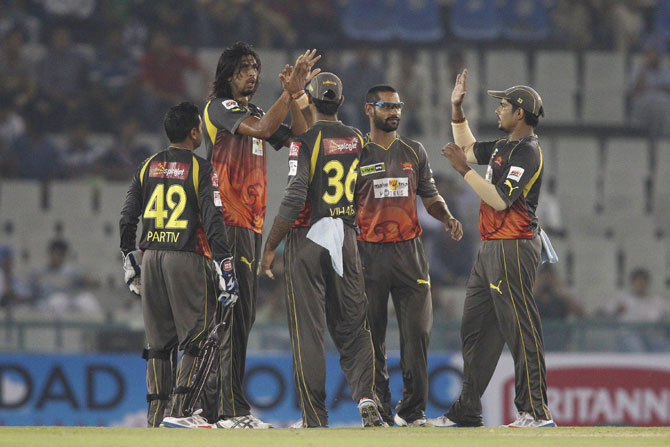Ishant Sharma is congratulated by his team mates after getting Evin Lewis