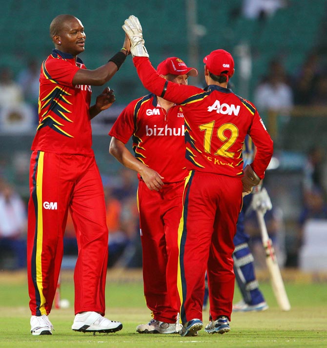 Lonwabo Tsotsobe (left) celebrates with team mates after taking the wicket of Brendon McCullum