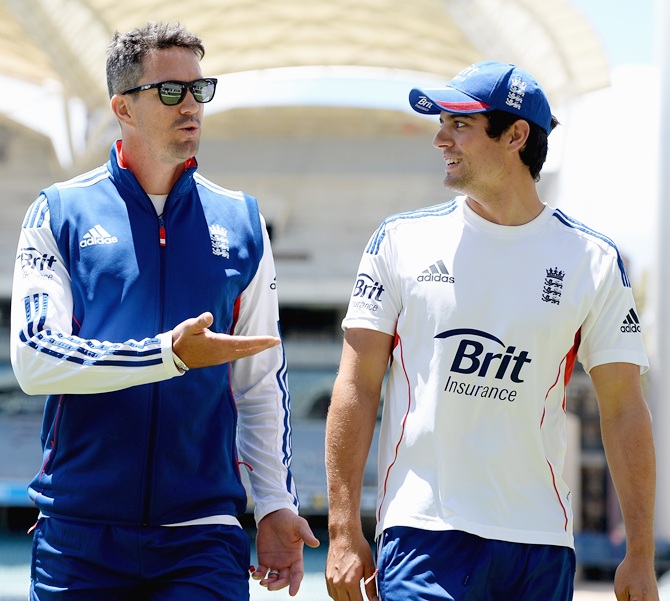 Kevin Pietersen speaks with England captain Alastair Cook