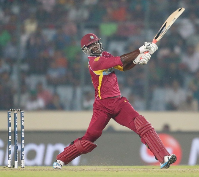Darren Sammy hits a six during the match against Pakistan