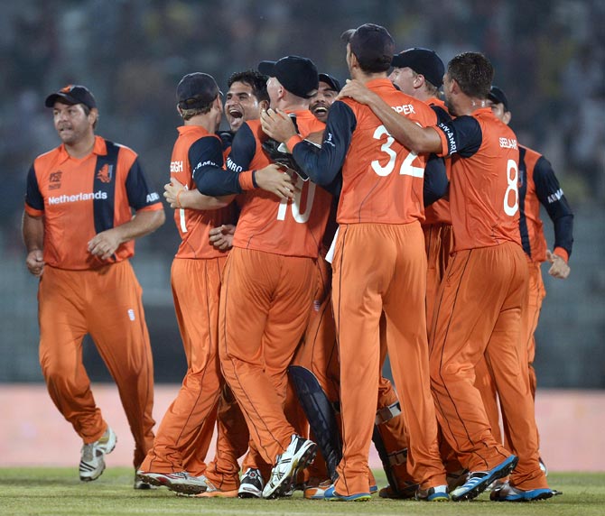 The Netherlands players celebrate after winning the match against England