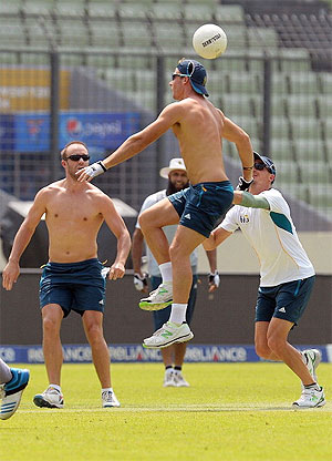South Africa captain Faf du Plessis (centre) and AB de Villiers play a warm-up football game at a training session during the ICC World Twenty20 tournament at the Sher-e-Bangla National Cricket Stadium in Dhaka on Wednesday