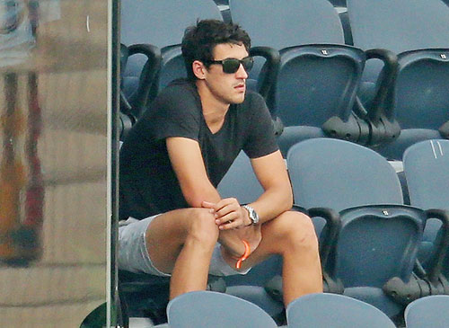 Mitchell Starc looks on from the stands during the ICC women's World T20 semi-final between Australia and West Indies