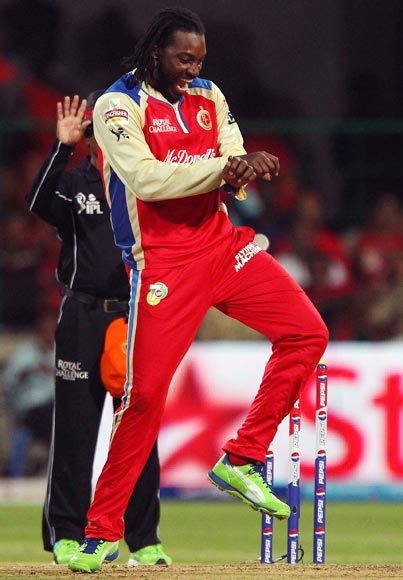 Chris Gayle celebrates taking a wicket