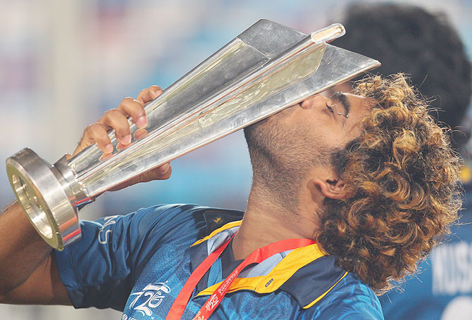 Sri Lanka's stand-in captain Lasith Malinga celebrates with the World T20 trophy on Sunday