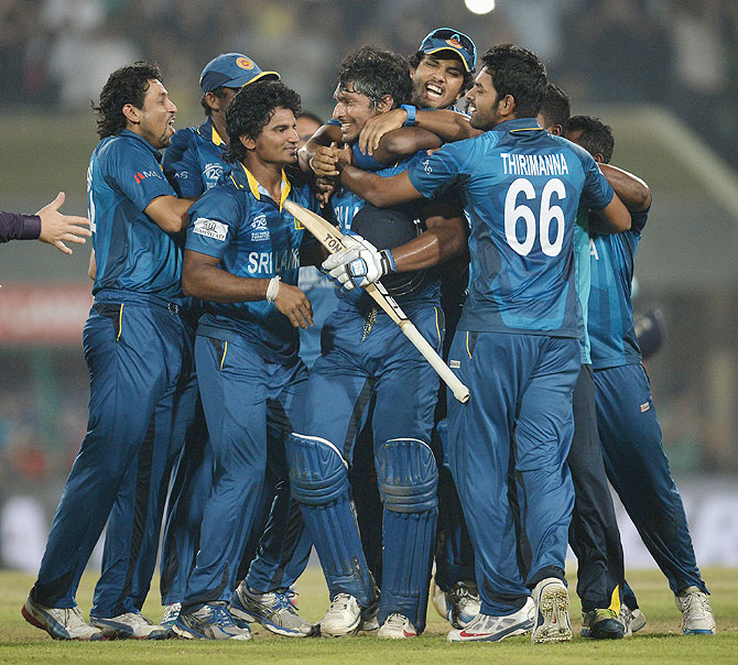 Kumar Sangakkara of Sri Lanka is mobbed by teammates in celebration after winning the ICC World Twenty20 title on Sunday