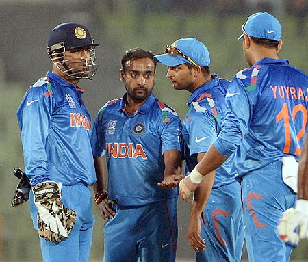 Amit Mishra celebrates the fall of a wicket 