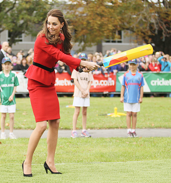 Kate Middleton swings wildly as she faces some 'fierce' bowling from husband Prince William