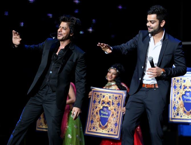 Virat Kohli (right) shakes a leg with Shah Rukh Khan. 