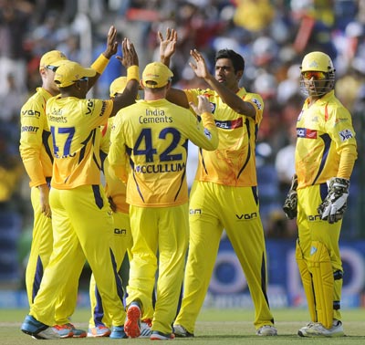 Chennai players celebrate the fall of a wicket