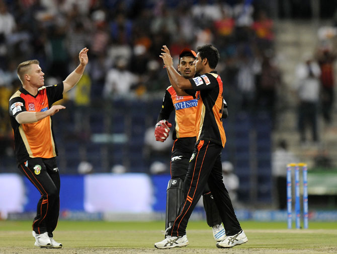 Bhuvneshwar Kumar celebrates with David Warner after taking a wicket