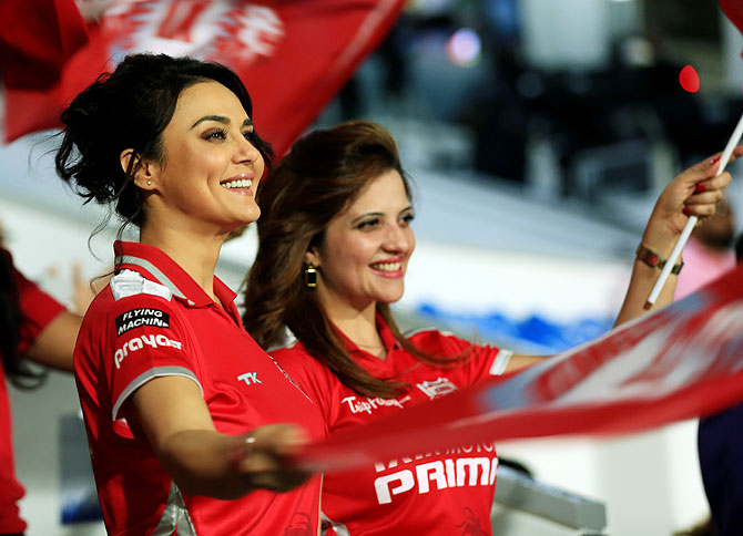 Preity Zinta and a friend are all smiles as Punjab go about their business in the middle