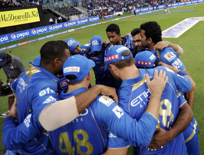Mumbai Indians players in a hurdle before a match
