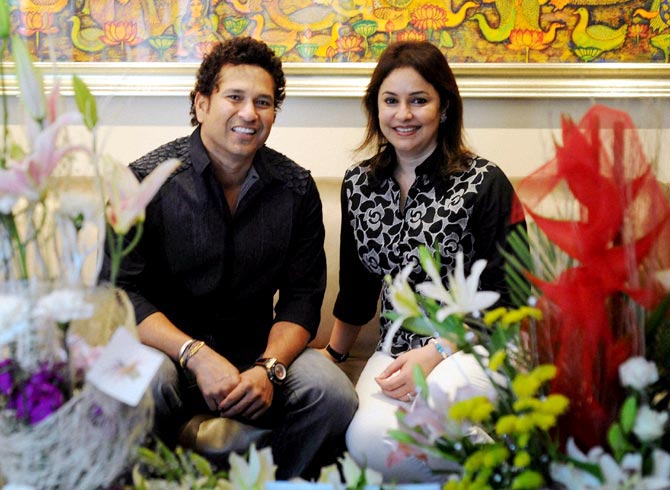 Sachin Tendulkar poses for a photograph with his wife Anjali during his 41st bithday celebrations at his residence in Mumbai on Thursday.