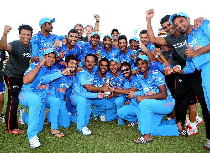 India 'A' players celebrate with the trophy after winning the Quadrangular A-Team One-Day Series in Darwin, on Saturday.
