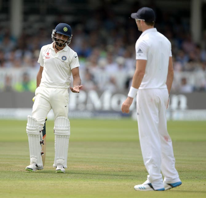 Ravindra Jadeja (left) of India speaks to England pace bowler James Anderson