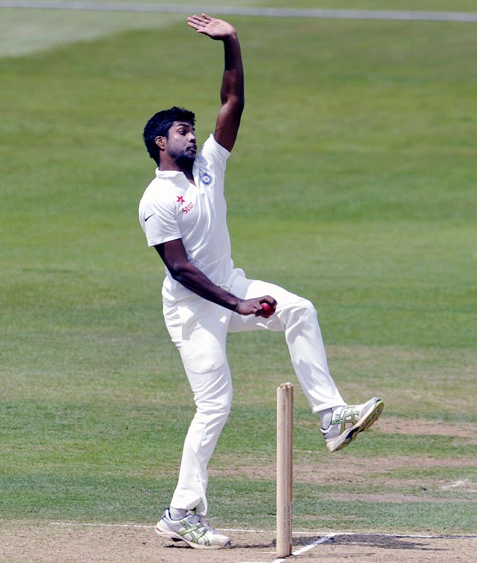 Varun Aaron of India bowls 