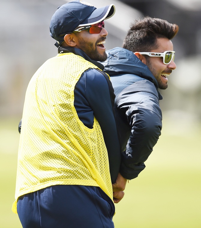 India batsman Ravindra Jadeja, left, and Virat Kholi share a lighter moment