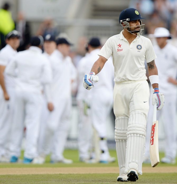 Virat Kohli of India leaves the field after being dismissed by James Anderson