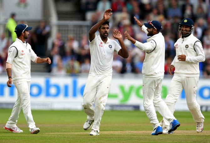 India bowler Varun Aaron (centre) celebrates after dismissing England batsman Moeen Ali