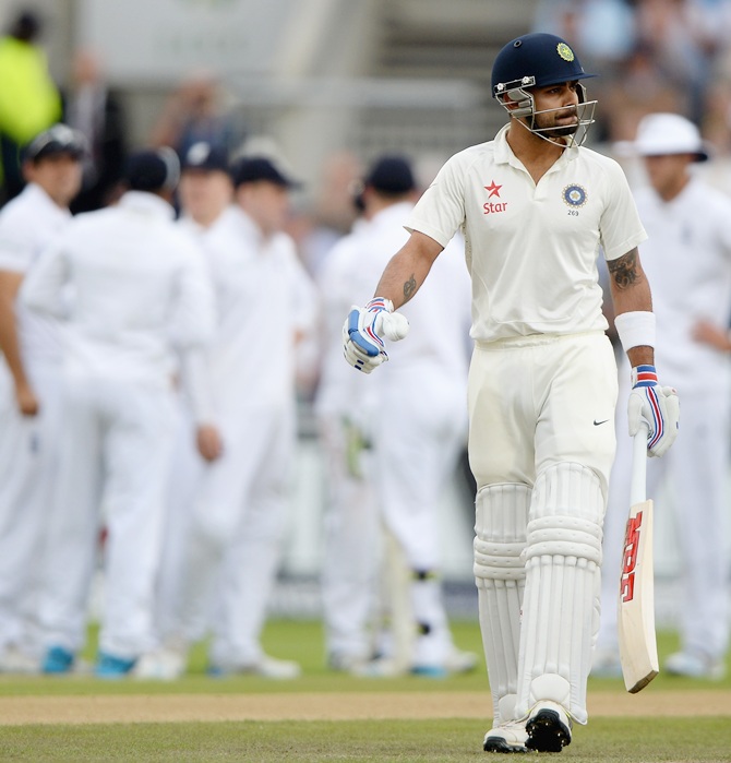 Virat Kohli leaves the field after being dismissed by James Anderson