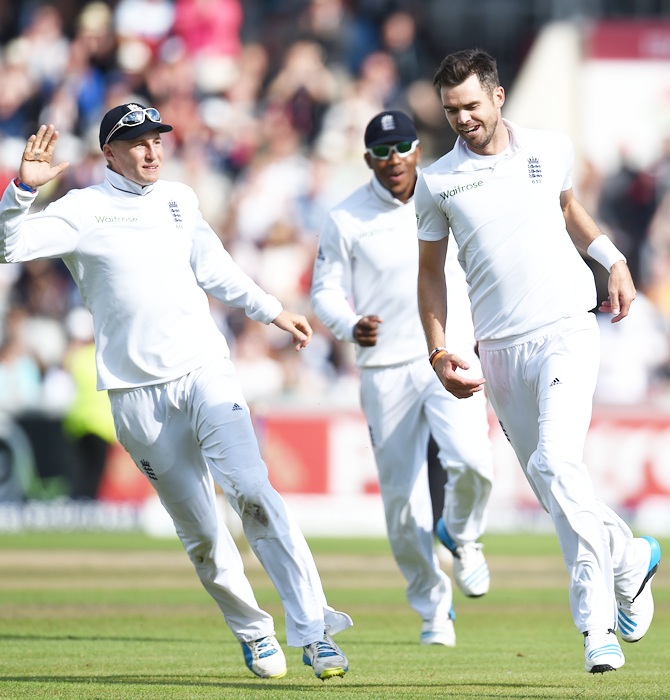 James Anderson (right) goes on a celebration run with Joe Root (left) and Chris Jordan (centre) after India batsman Virat Kohli is dismissed