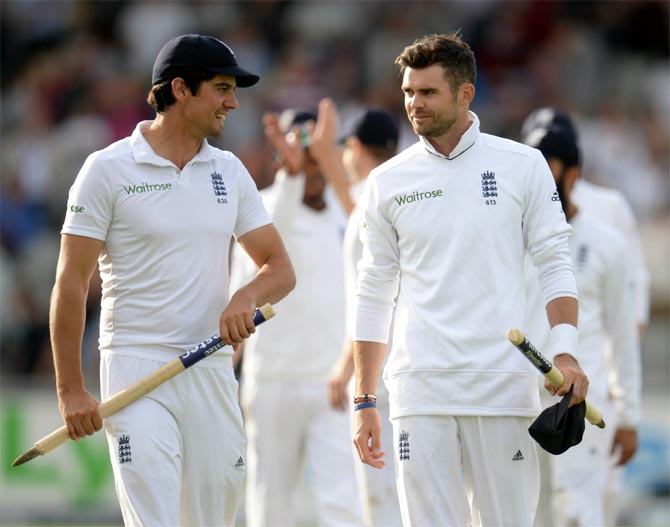 England's captain Alastair Cook (left) and James Anderson leave the field after winning the fourth Test match