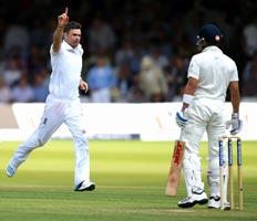 James Anderson (left) celebrates after taking the wicket of Virat Kohli.