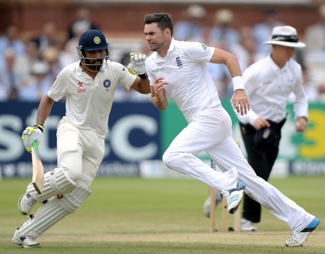 England's James Anderson (right) tries to stop the ball as India's Ravindra Jadeja takes a single