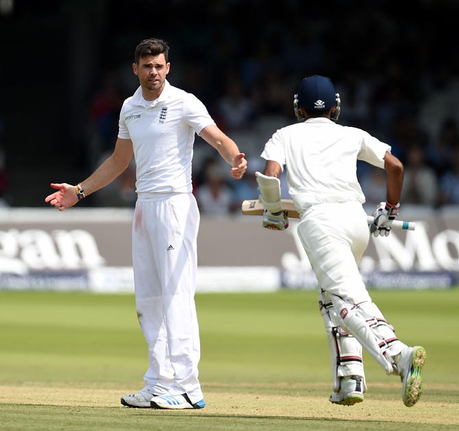 James Anderson (left) has a few words with India's Bhuvneshwar Kumar