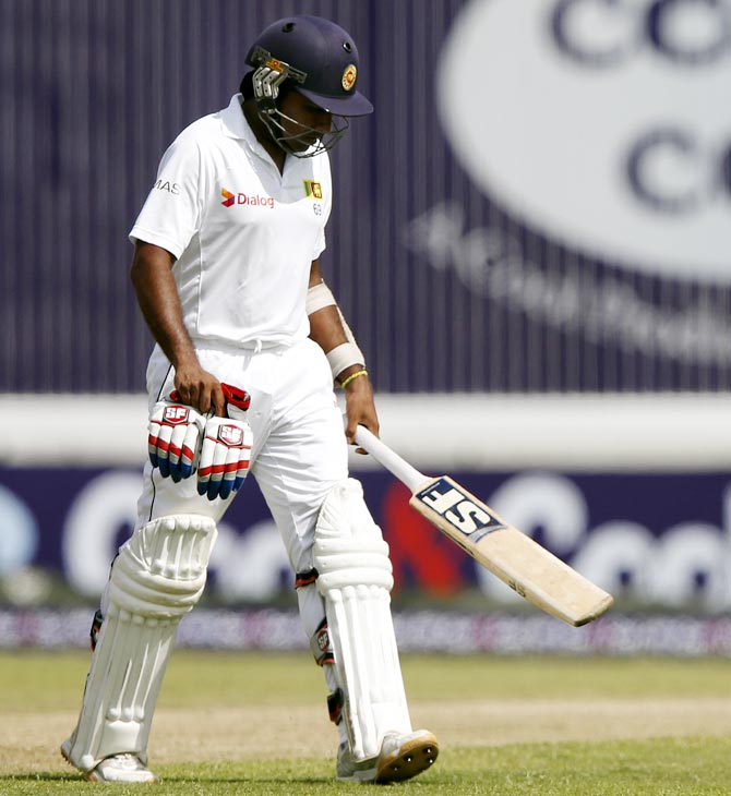 Mahela Jayawardene walks off the field after being dismissed by Saeed Ajmal in his final Test, against Pakistan, in Colombo, on Thursday.