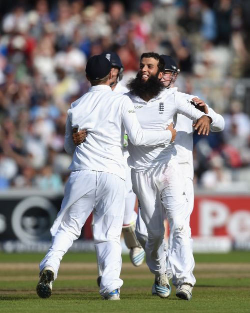 Moeen Ali celebrates a wicket with his England teammates